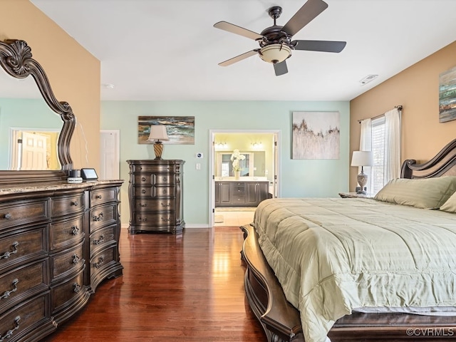 bedroom with ensuite bathroom, ceiling fan, and dark hardwood / wood-style flooring