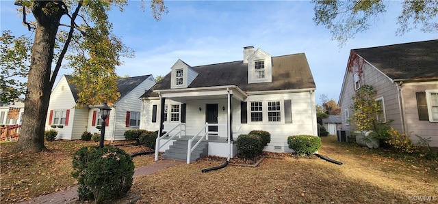 cape cod home with central air condition unit