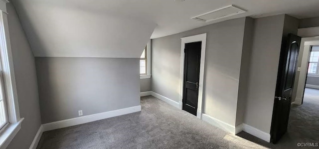 additional living space with lofted ceiling and carpet floors