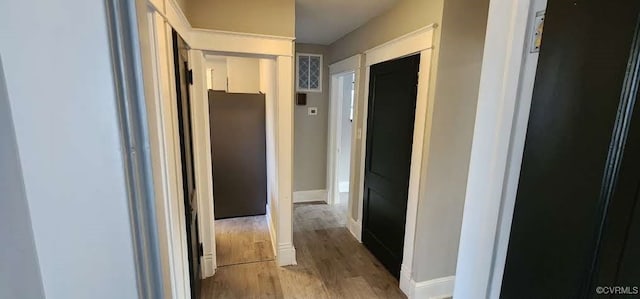 corridor featuring hardwood / wood-style flooring