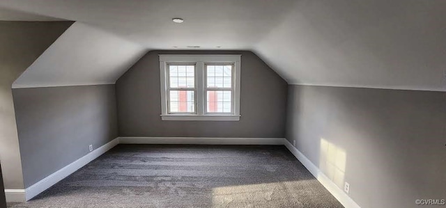 bonus room featuring carpet flooring and lofted ceiling