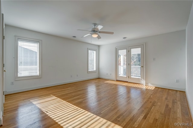 spare room with light hardwood / wood-style floors and ceiling fan