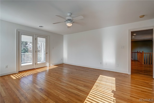 empty room featuring light wood-type flooring and ceiling fan