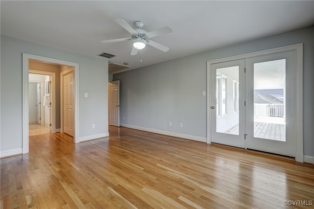 unfurnished living room featuring ceiling fan and light hardwood / wood-style flooring