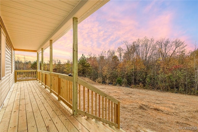 deck at dusk with covered porch