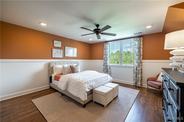 bedroom with ceiling fan and dark hardwood / wood-style flooring