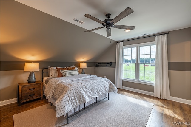 bedroom with lofted ceiling, wood-type flooring, and ceiling fan