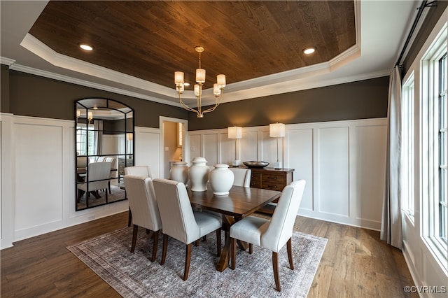 dining area with wooden ceiling, hardwood / wood-style flooring, crown molding, and a tray ceiling