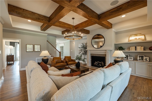 living room featuring coffered ceiling, dark hardwood / wood-style floors, and beam ceiling