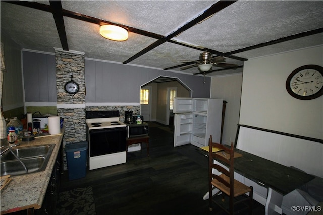 kitchen featuring white electric range oven, sink, dark hardwood / wood-style floors, a textured ceiling, and ceiling fan