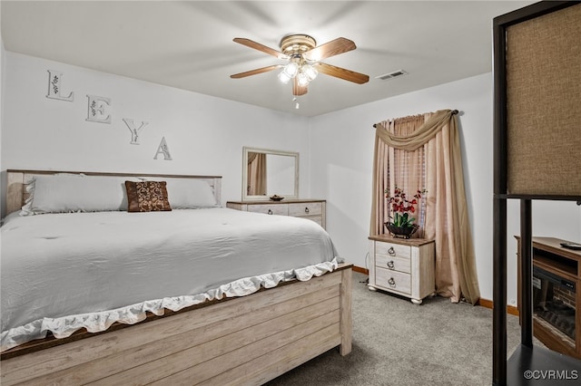 bedroom with ceiling fan and carpet floors