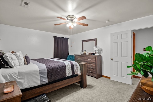 bedroom with ceiling fan and light colored carpet