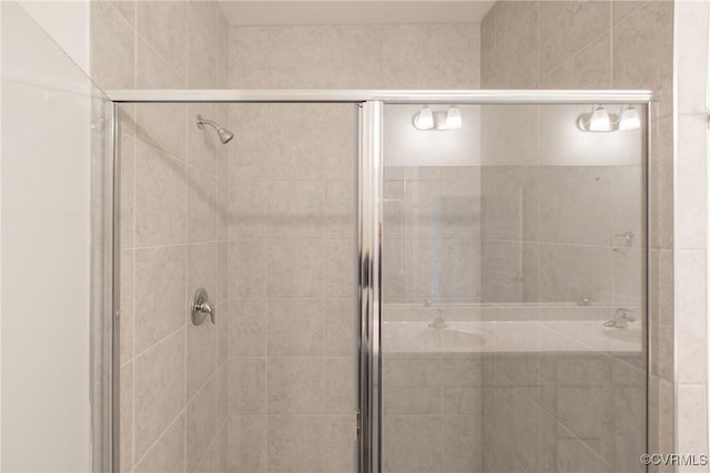 full bathroom featuring a stall shower