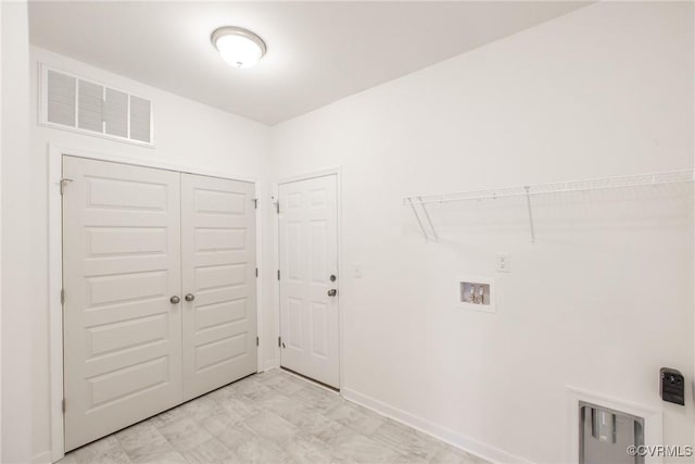 washroom featuring laundry area, visible vents, baseboards, and hookup for a washing machine