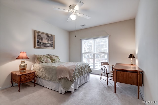 bedroom with light carpet and ceiling fan