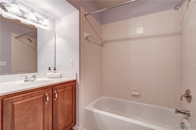 bathroom with vanity and tiled shower / bath combo