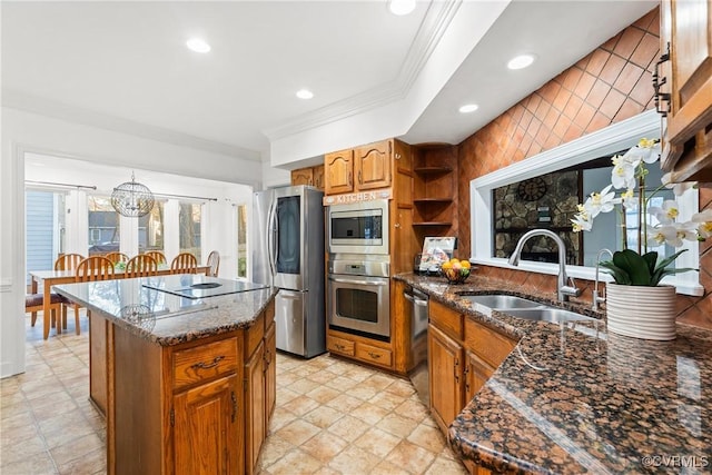 kitchen featuring brown cabinets, ornamental molding, a sink, a center island, and stainless steel appliances