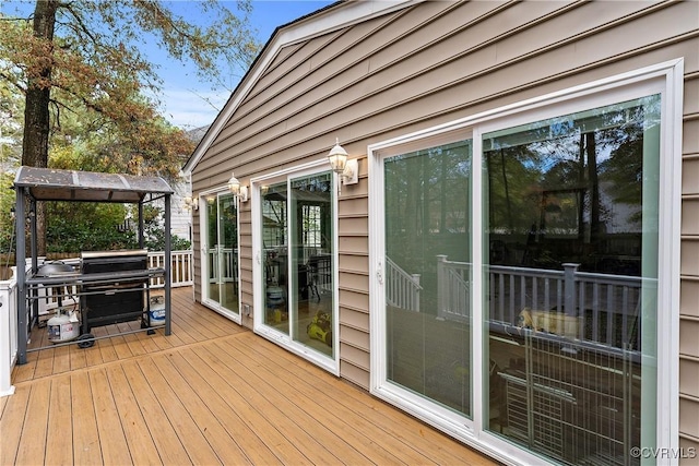 wooden terrace with area for grilling