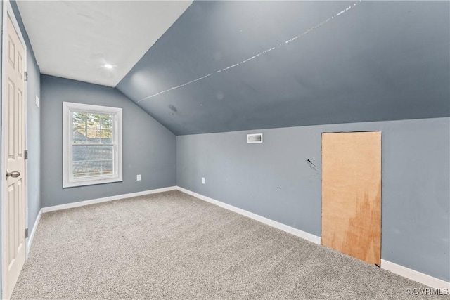 bonus room with visible vents, baseboards, lofted ceiling, and carpet