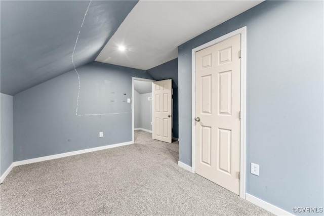 bonus room with vaulted ceiling, carpet flooring, and baseboards