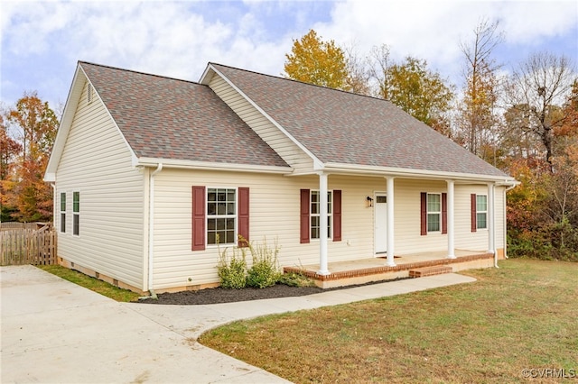 view of front of house with a porch and a front yard