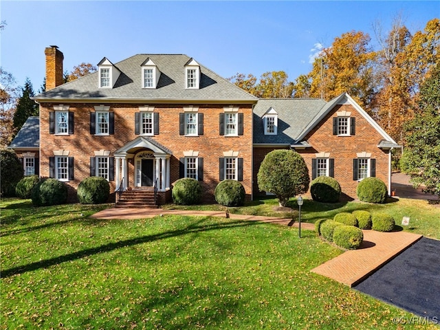 colonial home with a front yard