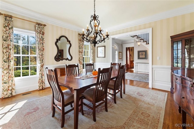 1300 Sabot Creek Ct, Manakin Sabot, VA 23103 - dining area featuring a chandelier, wainscoting, crown molding, wallpapered walls, and wood finished floors