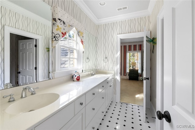 bathroom with vanity, plenty of natural light, and crown molding