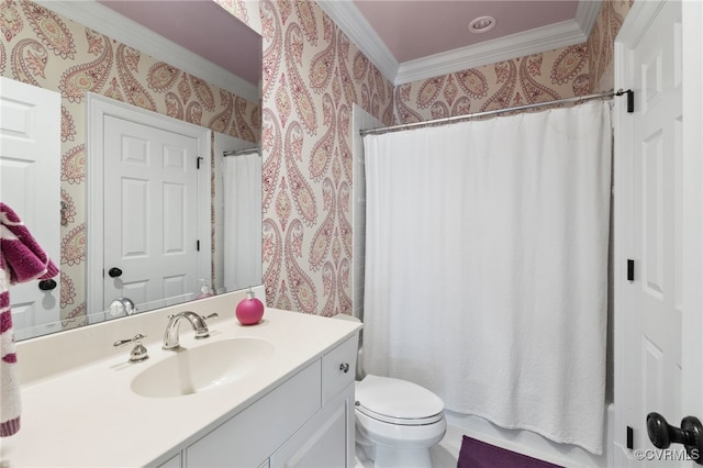 bathroom with toilet, vanity, and ornamental molding