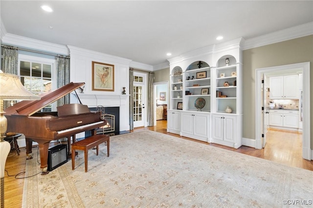 1300 Sabot Creek Ct, Manakin Sabot, VA 23103 - sitting room with light wood-style flooring, crown molding, a fireplace with flush hearth, and recessed lighting