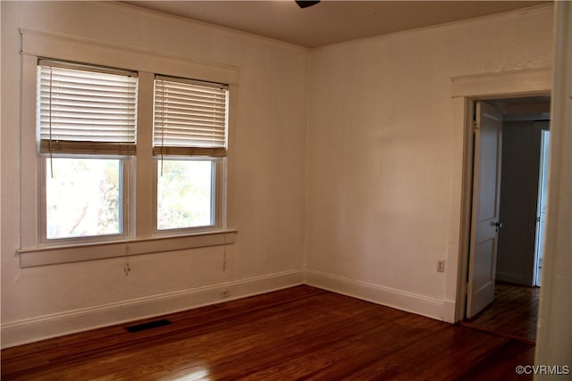 empty room featuring dark hardwood / wood-style flooring