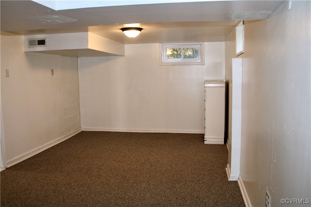 basement with dark carpet