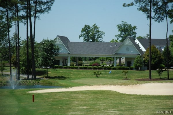 view of property's community featuring a yard