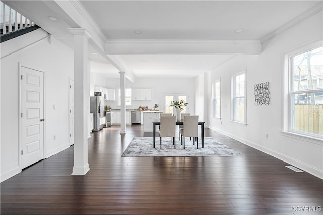 dining room with crown molding and dark hardwood / wood-style flooring