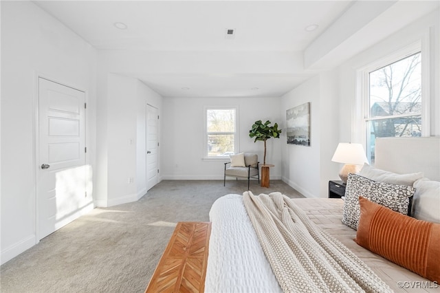 bedroom featuring light carpet