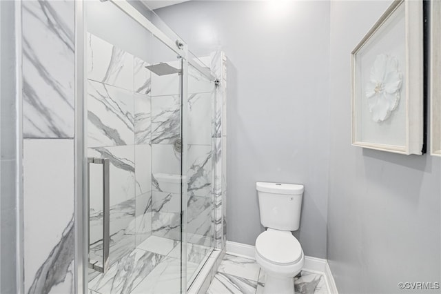 bathroom featuring walk in shower and toilet