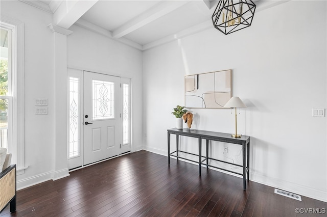 entryway featuring dark hardwood / wood-style flooring, beamed ceiling, and a notable chandelier