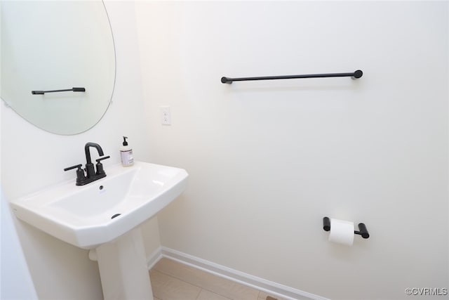 bathroom with tile patterned flooring and sink