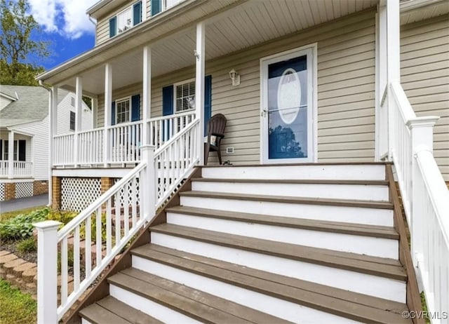 doorway to property with covered porch