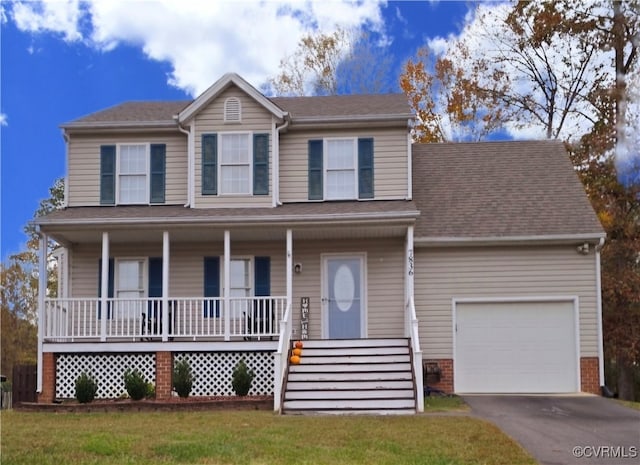 view of front of home with a porch, a garage, and a front lawn