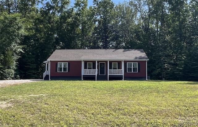 ranch-style home with a front yard and a porch