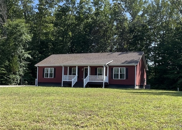 ranch-style home featuring a front lawn and a porch