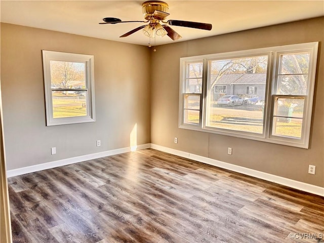 unfurnished room with hardwood / wood-style flooring and ceiling fan