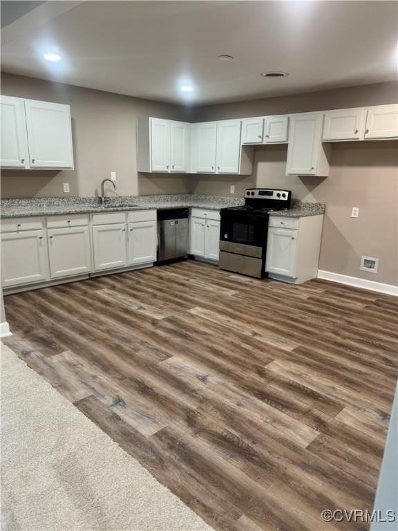 kitchen with white cabinetry, sink, dark wood-type flooring, and appliances with stainless steel finishes