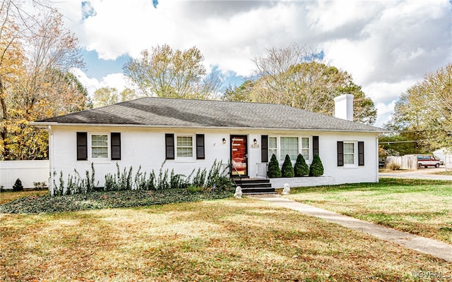 single story home featuring a front yard