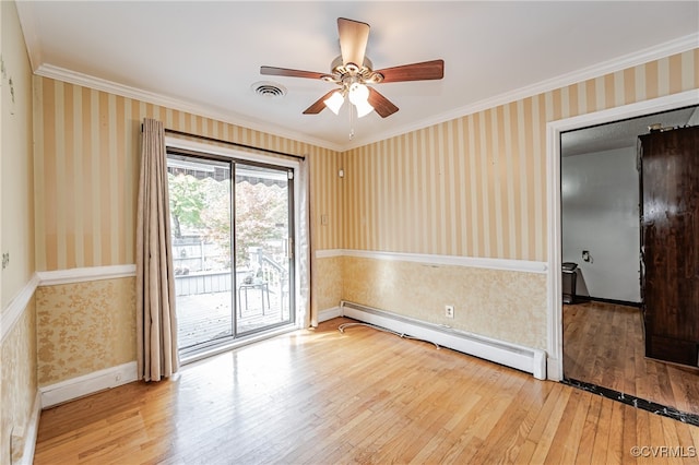 spare room with baseboard heating, wood-type flooring, ceiling fan, and crown molding