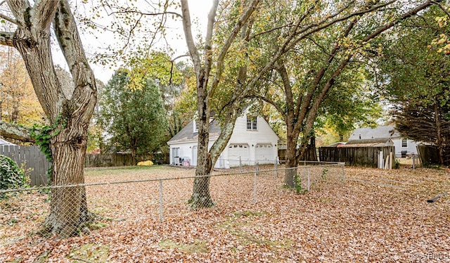 view of yard with an outbuilding and a garage