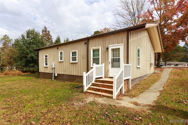 back of house with a yard