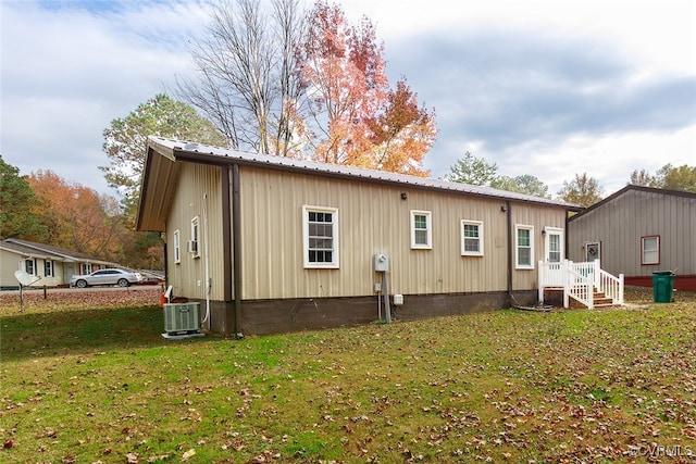 rear view of house with a lawn