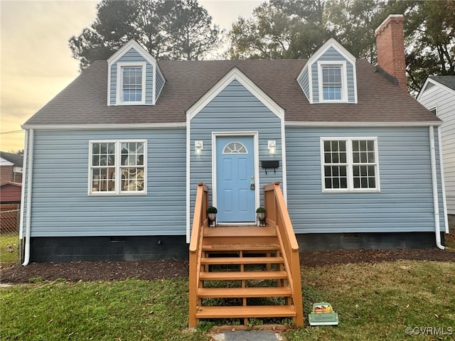 view of front of house featuring a lawn